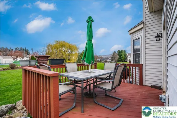a view of a chairs and table in patio