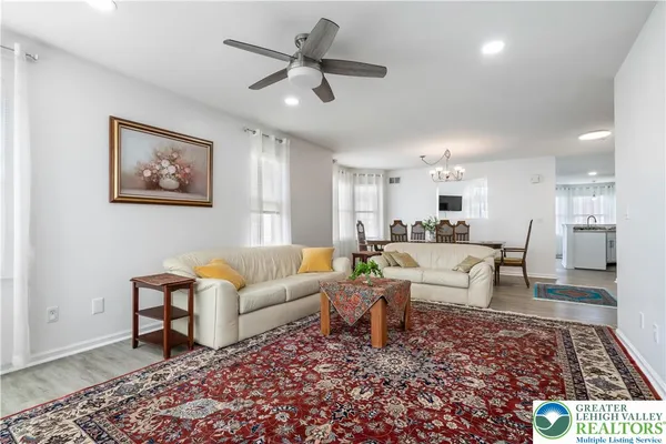 a living room with furniture and a rug