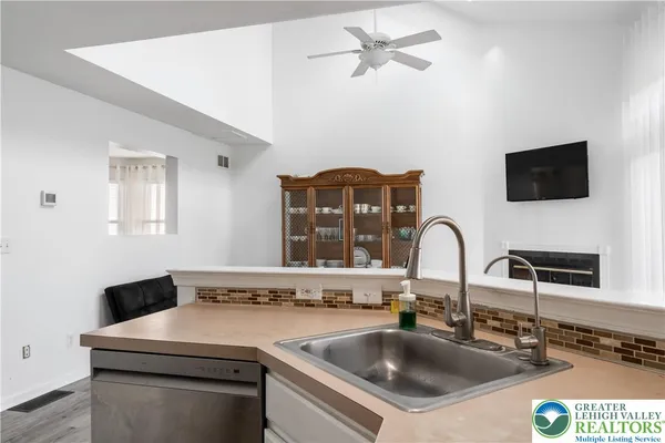 a close view of a sink and a stove in a room