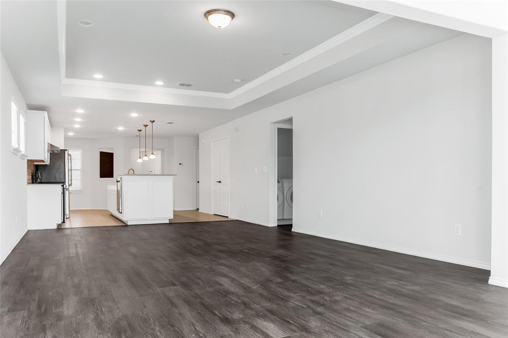 7793 Gulf Walk Road Frisco, TX 75036 - Photo 19 of 37 a view of an empty room with wooden floor