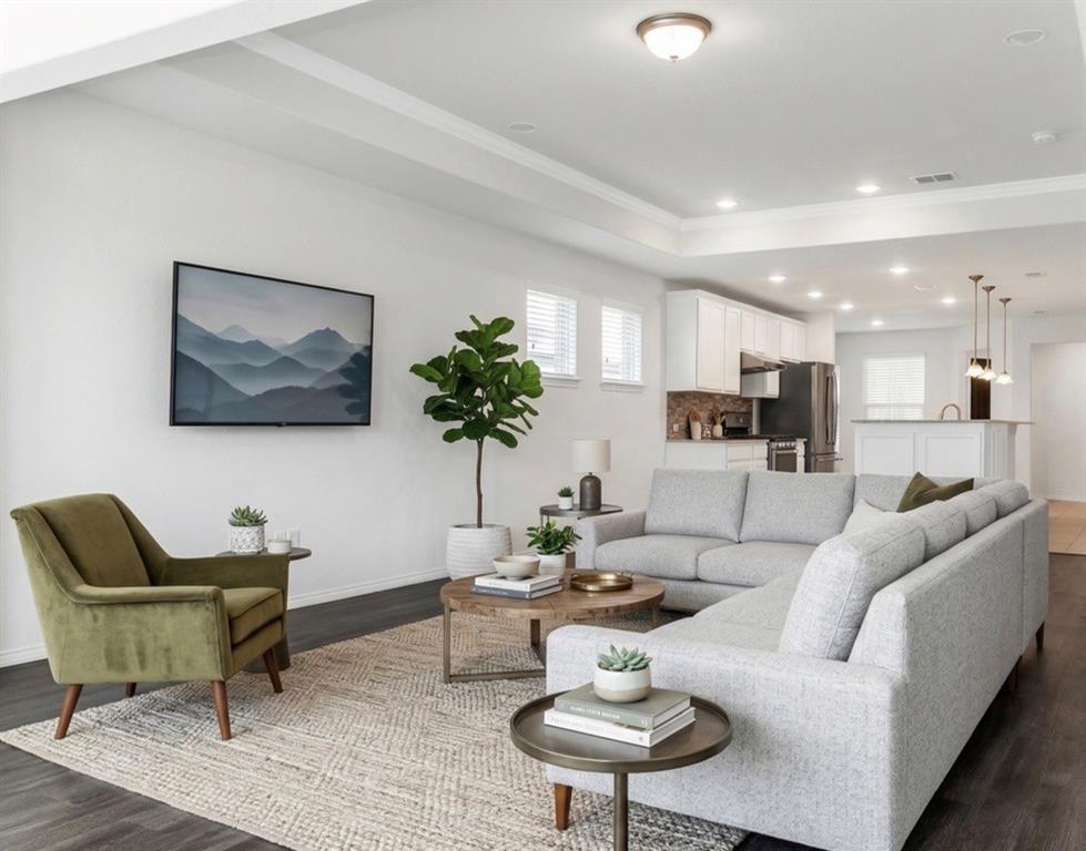 7793 Gulf Walk Road Frisco, TX 75036 - Photo 20 of 37 a living room with furniture a dining table and kitchen view