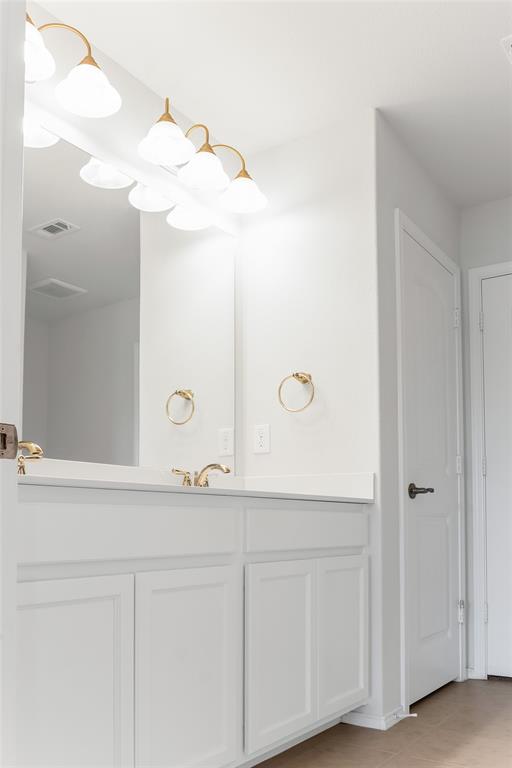 7793 Gulf Walk Road Frisco, TX 75036 - Photo 30 of 37 a bathroom with a sink and mirror