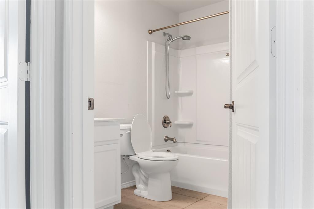 7793 Gulf Walk Road Frisco, TX 75036 - Photo 32 of 37 a bathroom with a sink toilet and shower