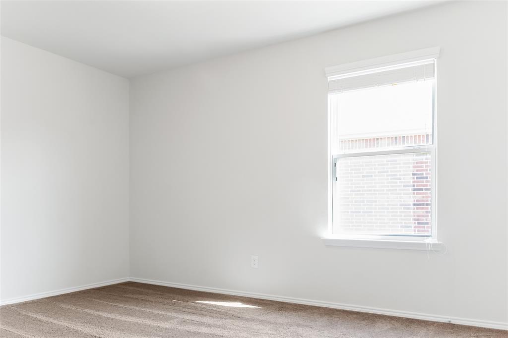 7793 Gulf Walk Road Frisco, TX 75036 - Photo 33 of 37 an empty room with a window
