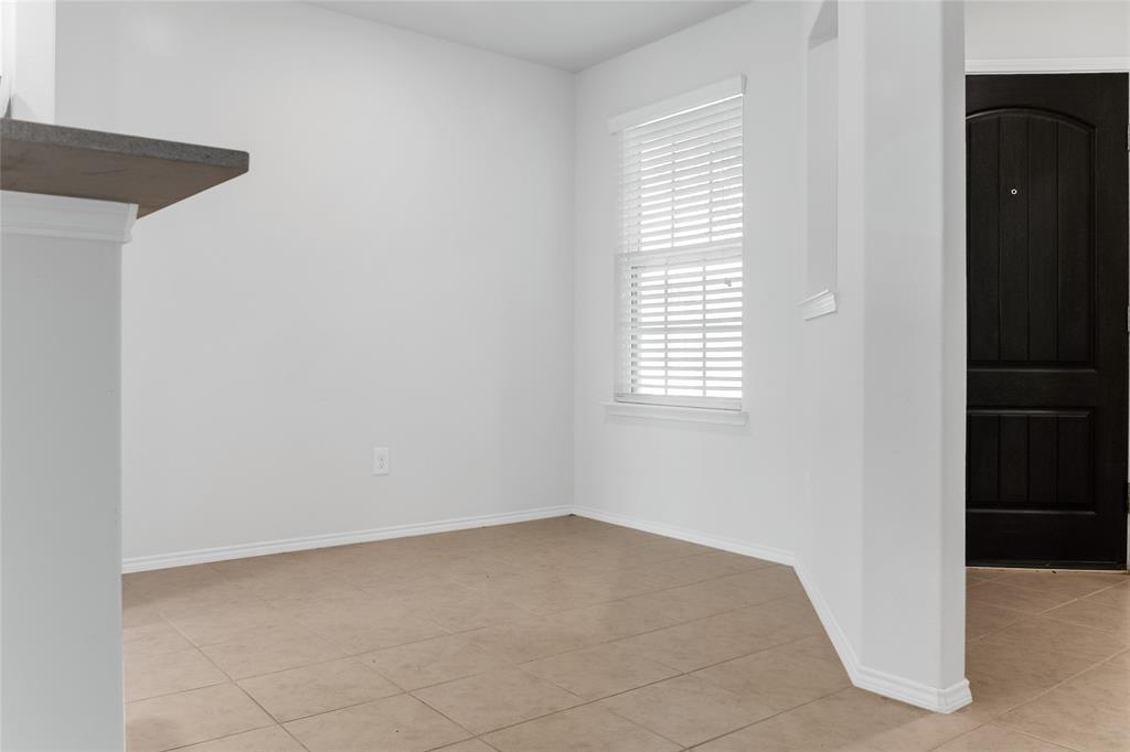 7793 Gulf Walk Road Frisco, TX 75036 - Photo 7 of 37 a view of an empty room with a window