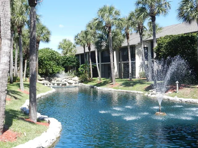 a view of a water fountain in front of a house