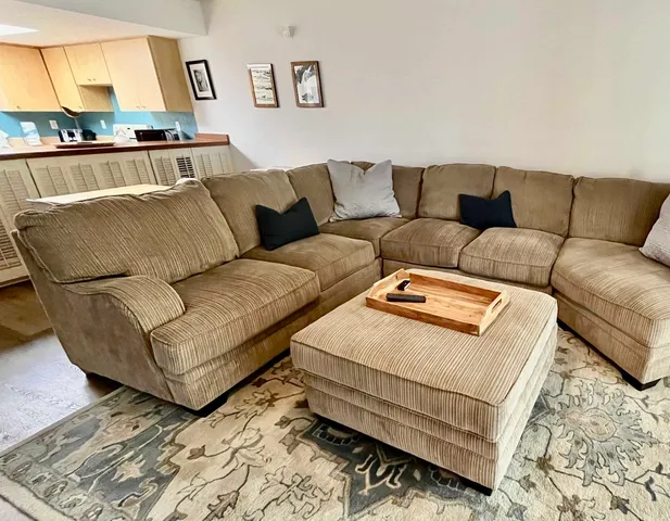 a living room with a couch and a window