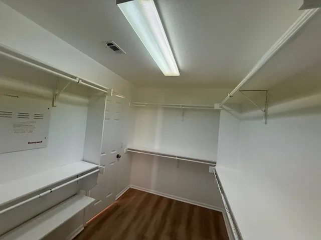 a view of empty room with windows