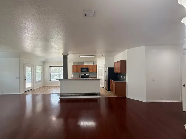 a view of hallway with wooden floor