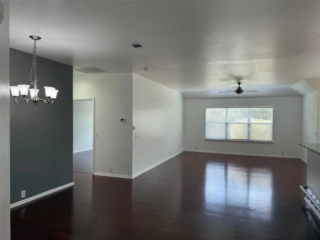 a kitchen with stainless steel appliances a refrigerator and a stove top oven