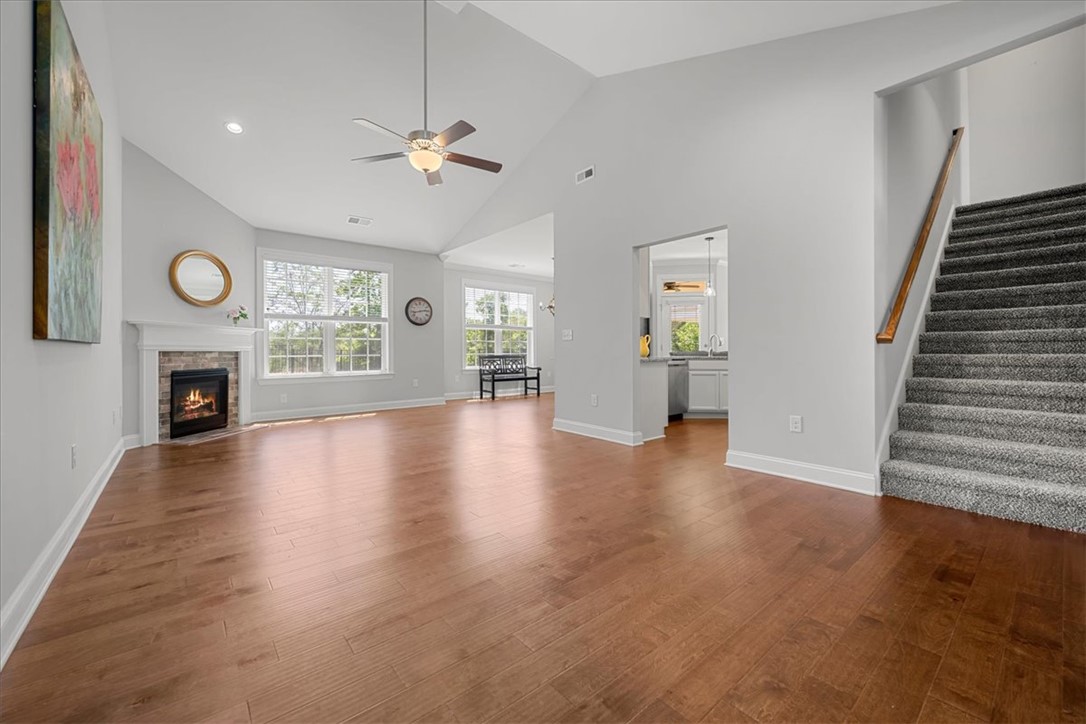 21 Barron Glenn Way Anderson, SC 29621 - Photo 11 of 48 This generous living space features rich hardwood floors, a cozy fireplace, and abundant natural light from multiple windows.