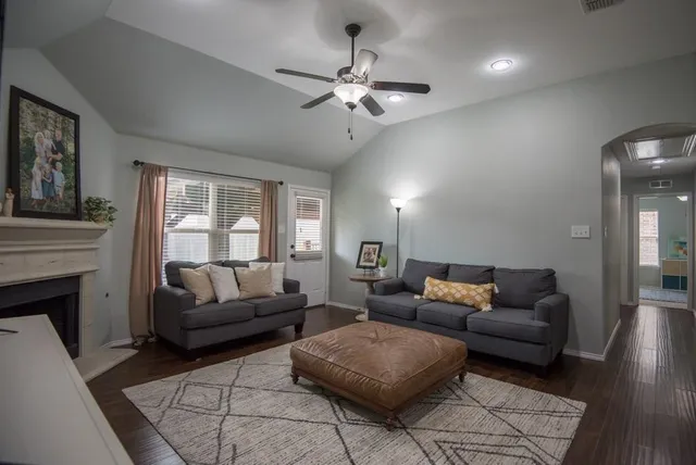 a kitchen with stainless steel appliances granite countertop a sink and a refrigerator