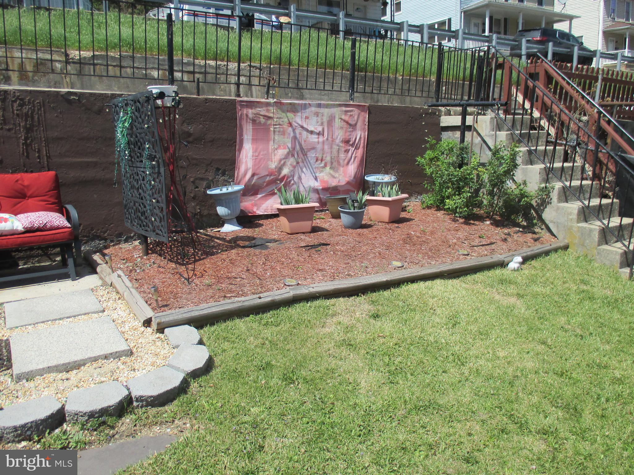 333 Pratt Street Luke, MD 21540 - Photo 40 of 42 a view of a backyard with a chair