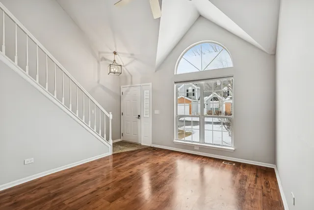 a view of an entryway with wooden floor