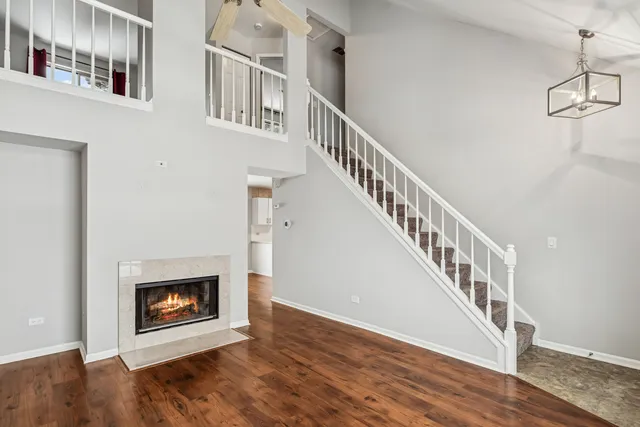 a view of an entryway and wooden floor