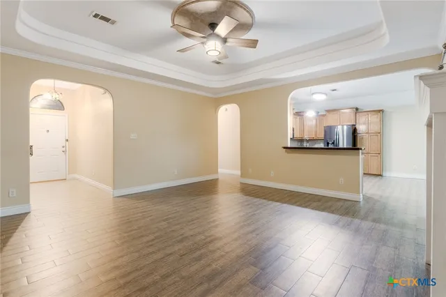 a view of a kitchen and a stove wooden floor