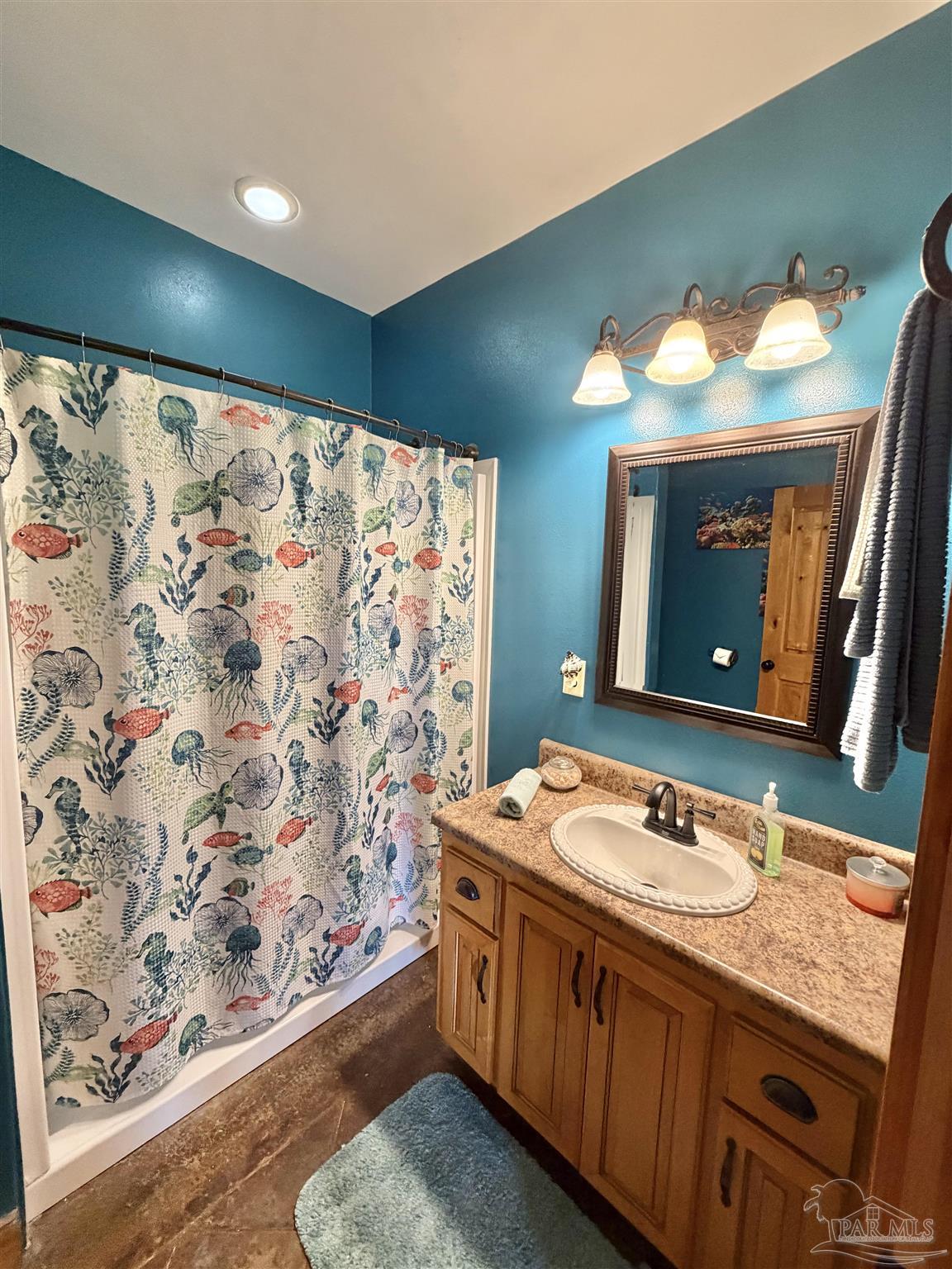 145 Tower Road Uriah, AL 36480 - Photo 17 of 72 a bathroom with a granite countertop sink a toilet and a large mirror