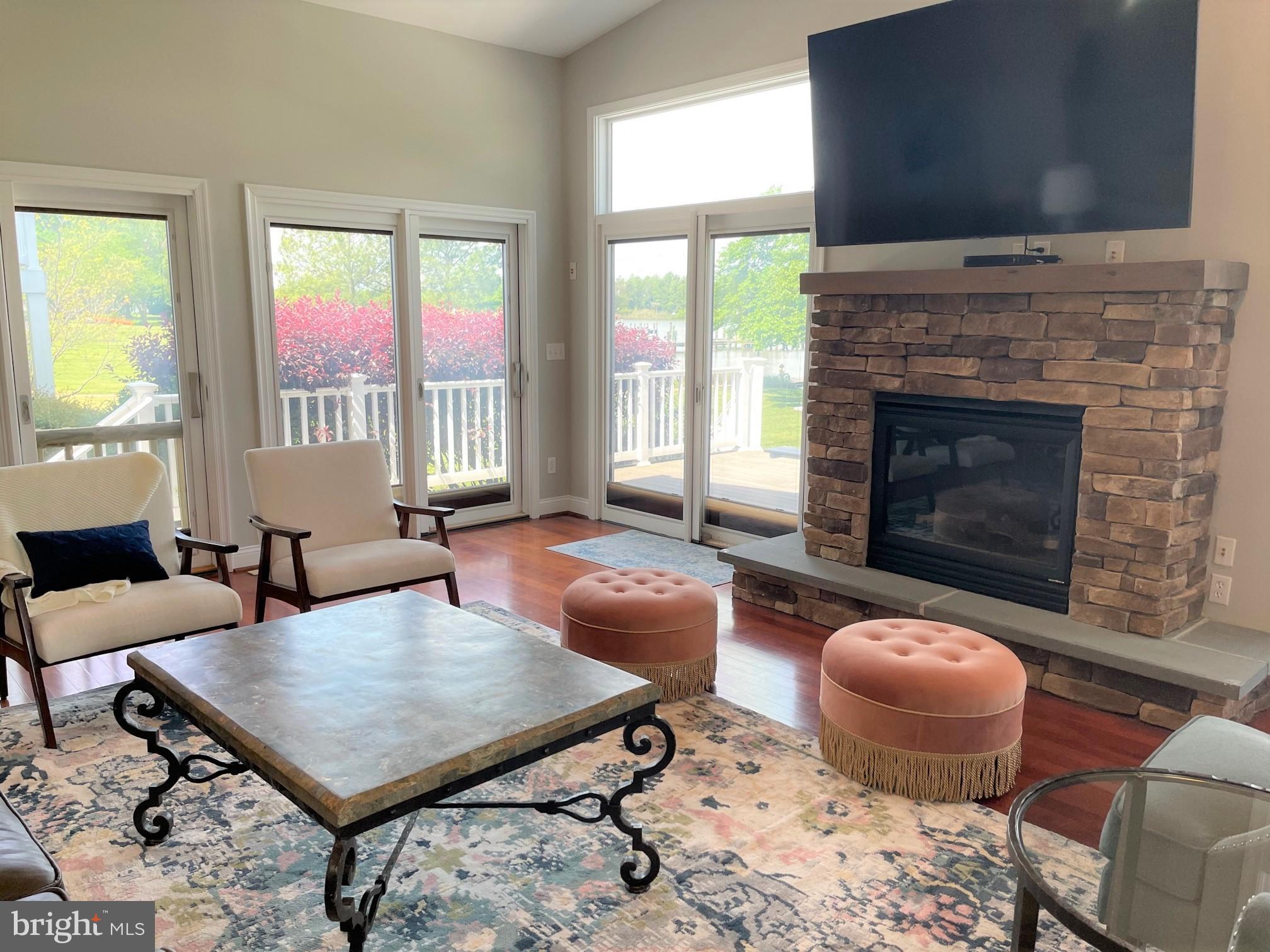 226 Bentons Pleasure Road Chester, MD 21619 - Photo 17 of 49 a living room with furniture a table and a fireplace