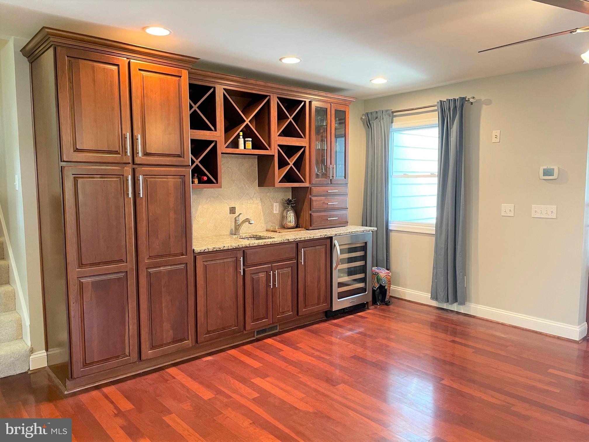 226 Bentons Pleasure Road Chester, MD 21619 - Photo 19 of 45 Elegant wet bar with rich wood accents.