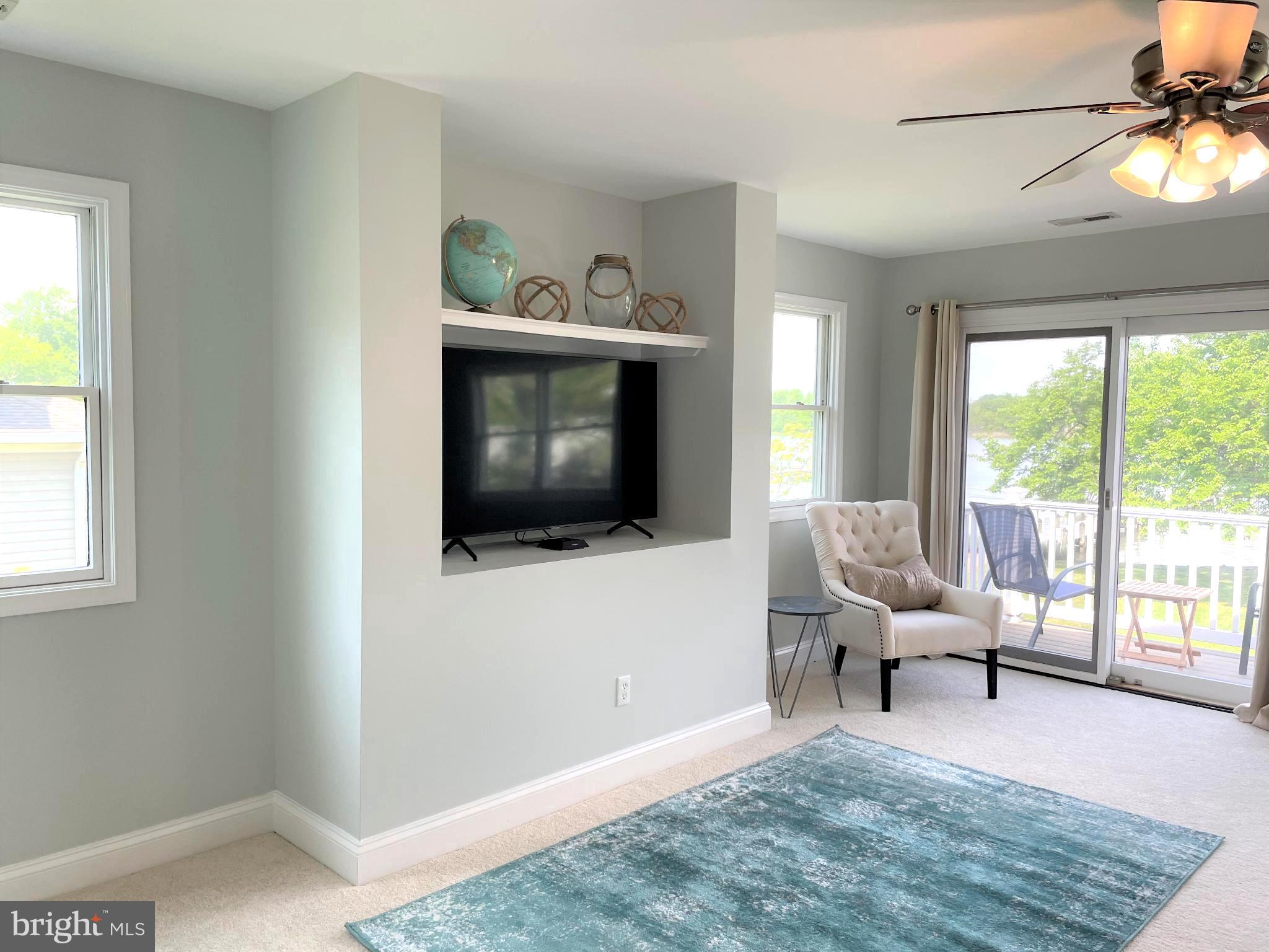 226 Bentons Pleasure Road Chester, MD 21619 - Photo 24 of 49 a living room with furniture and a flat screen tv