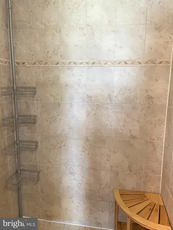 a bathroom with a shower and a bathtub