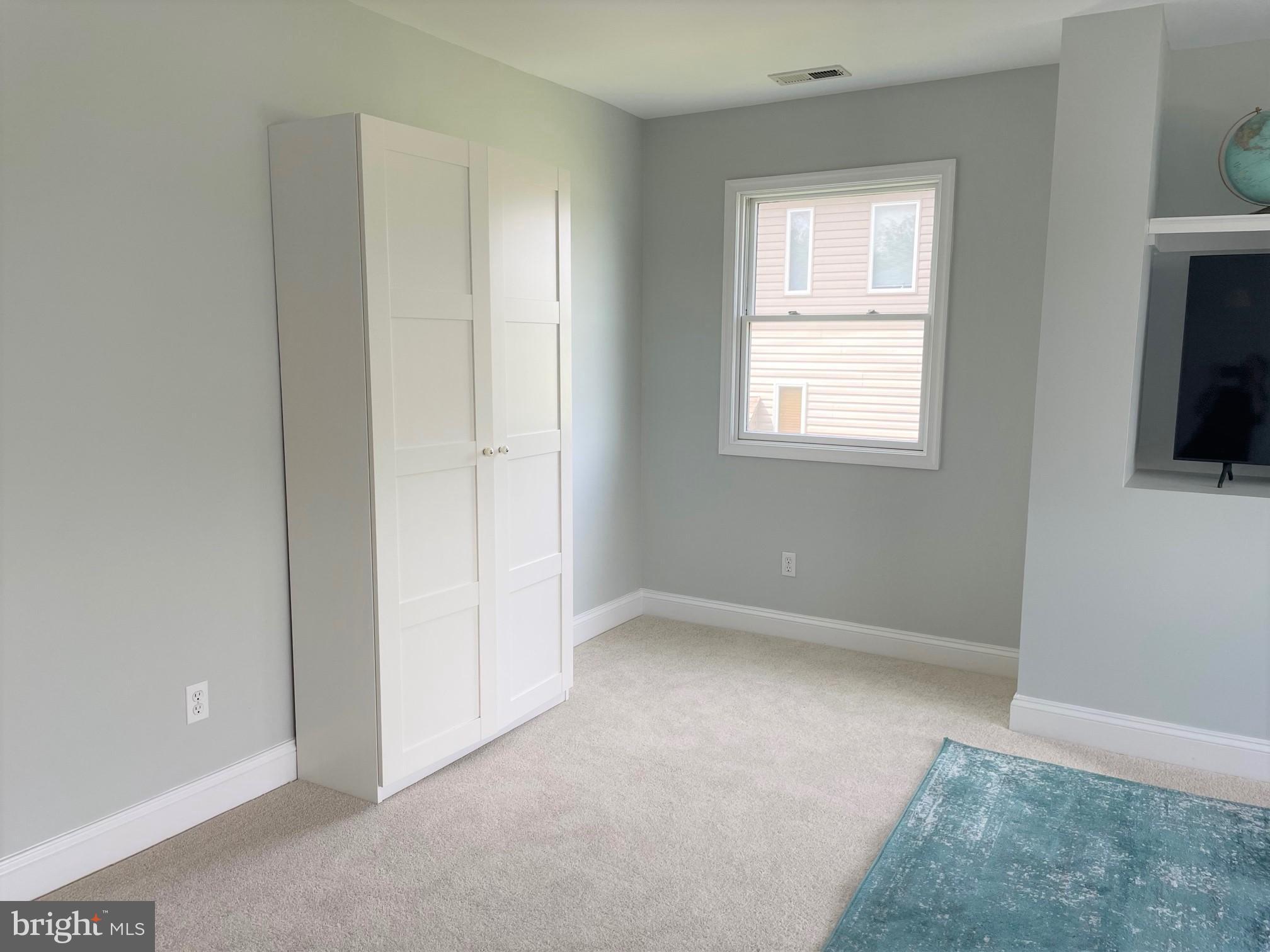 226 Bentons Pleasure Road Chester, MD 21619 - Photo 40 of 49 an empty room with windows