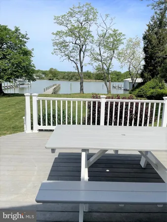 a view of a chairs and table on the deck