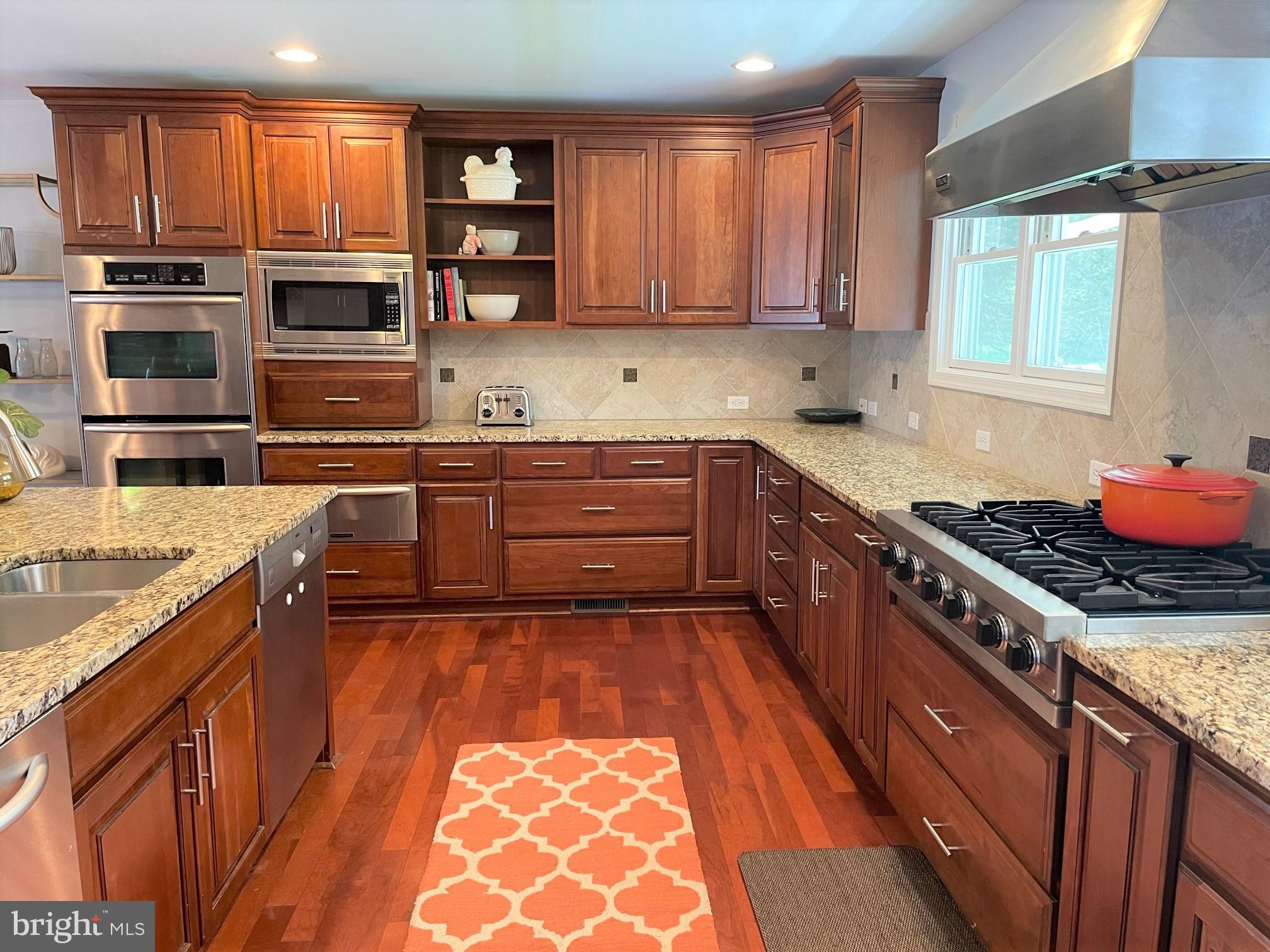 226 Bentons Pleasure Road Chester, MD 21619 - Photo 5 of 49 a kitchen with stainless steel appliances granite countertop a stove top oven a sink and dishwasher