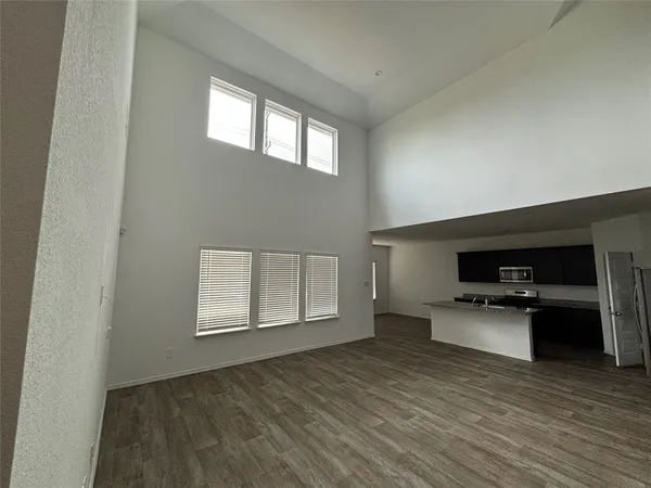 a kitchen with a refrigerator and a sink