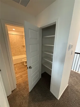 a view of a hallway with windows
