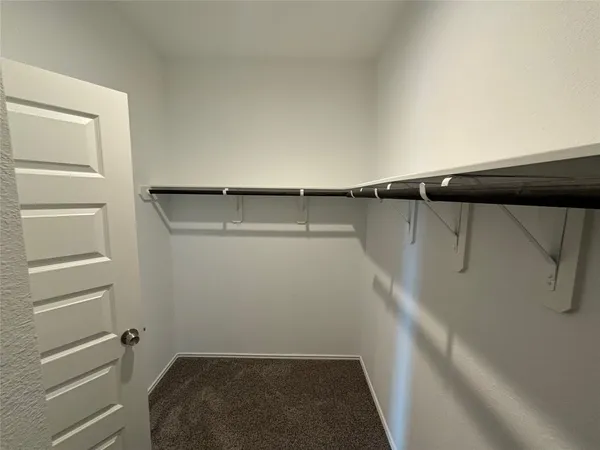 a bathroom with a glass door shower
