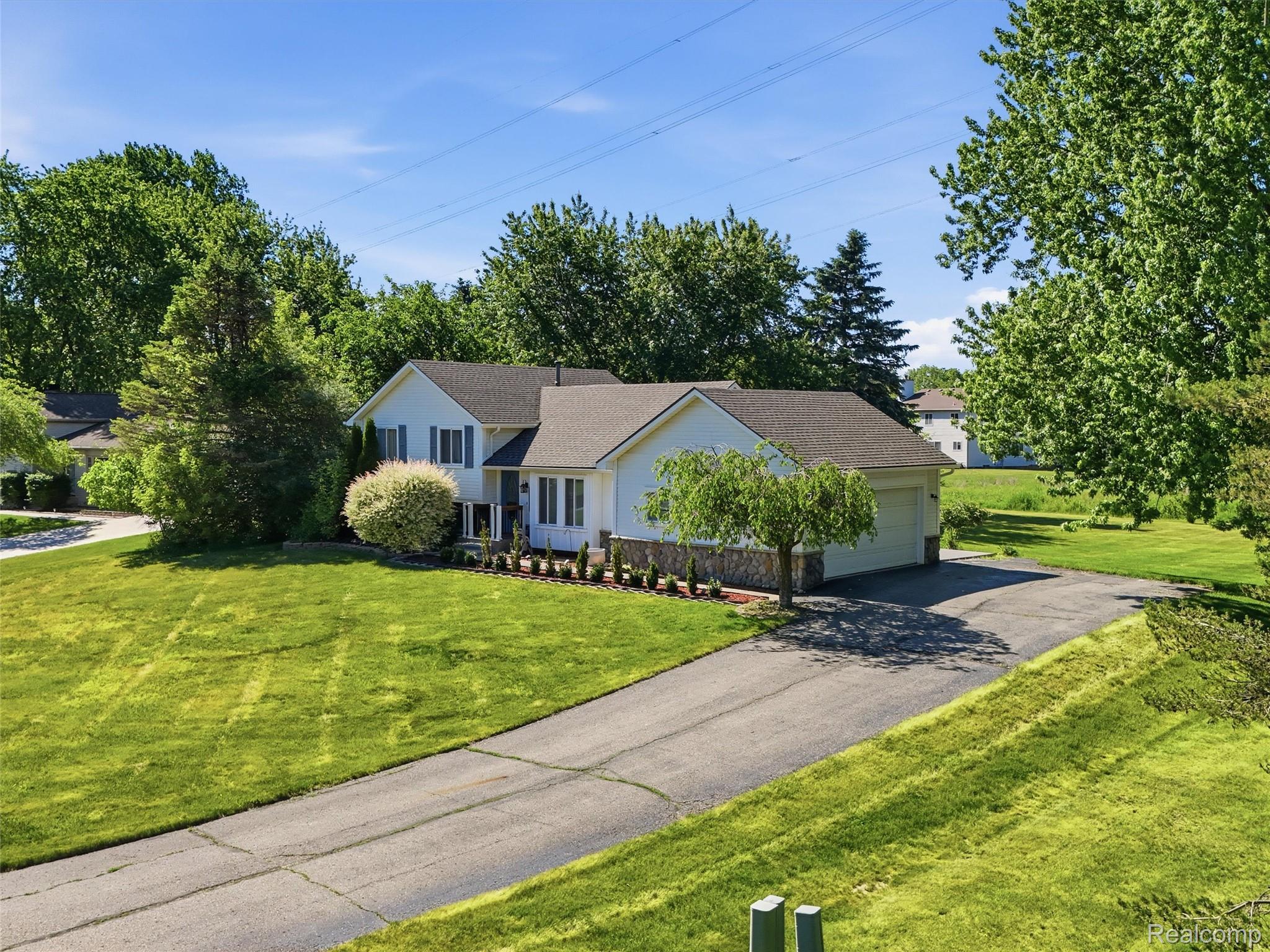 1087 Eagle Nest Drive Rochester, MI 48306 - Photo 1 of 39 06-DJI_20260607165606_0313_D.jpg