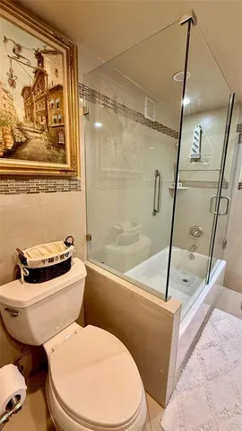 a spacious bedroom with a bed and a window