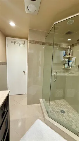 a living room with furniture and a mirror