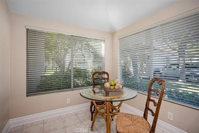 a view of a dining room with furniture and window