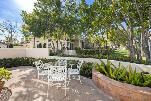 a view of backyard with seating and green space