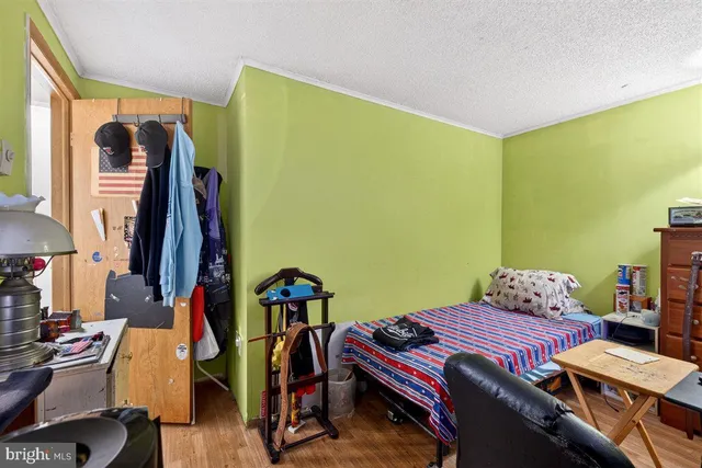 a bedroom with a bed and a closet