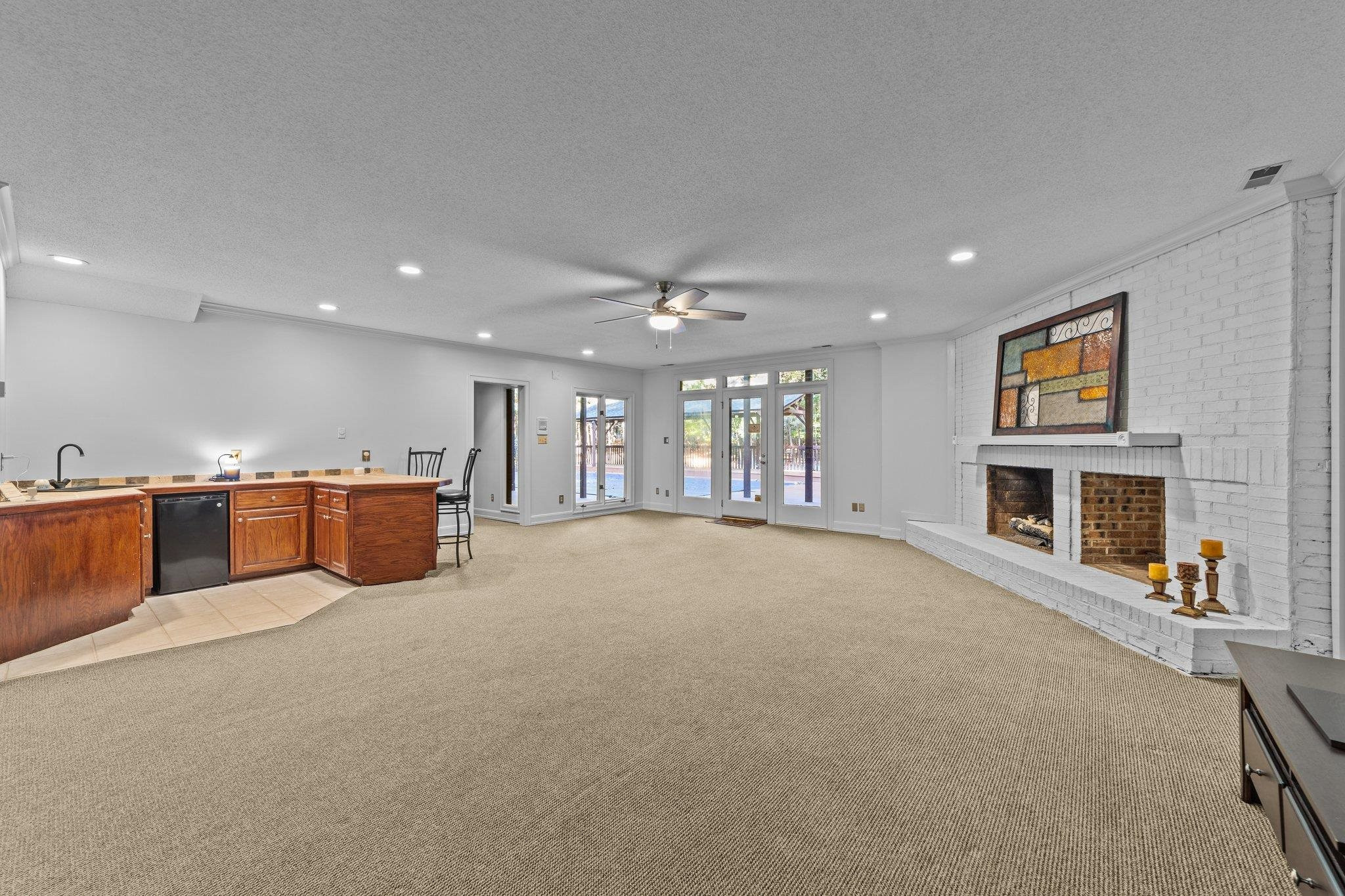 217 Carpathian Way Raleigh, NC 27615 - Photo 9 of 28 Large Family Room in Basement w/ Brick Gas Fireplace