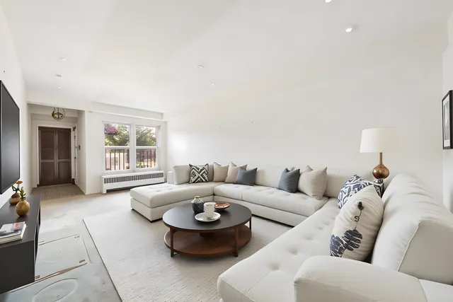 a living room with furniture and a window