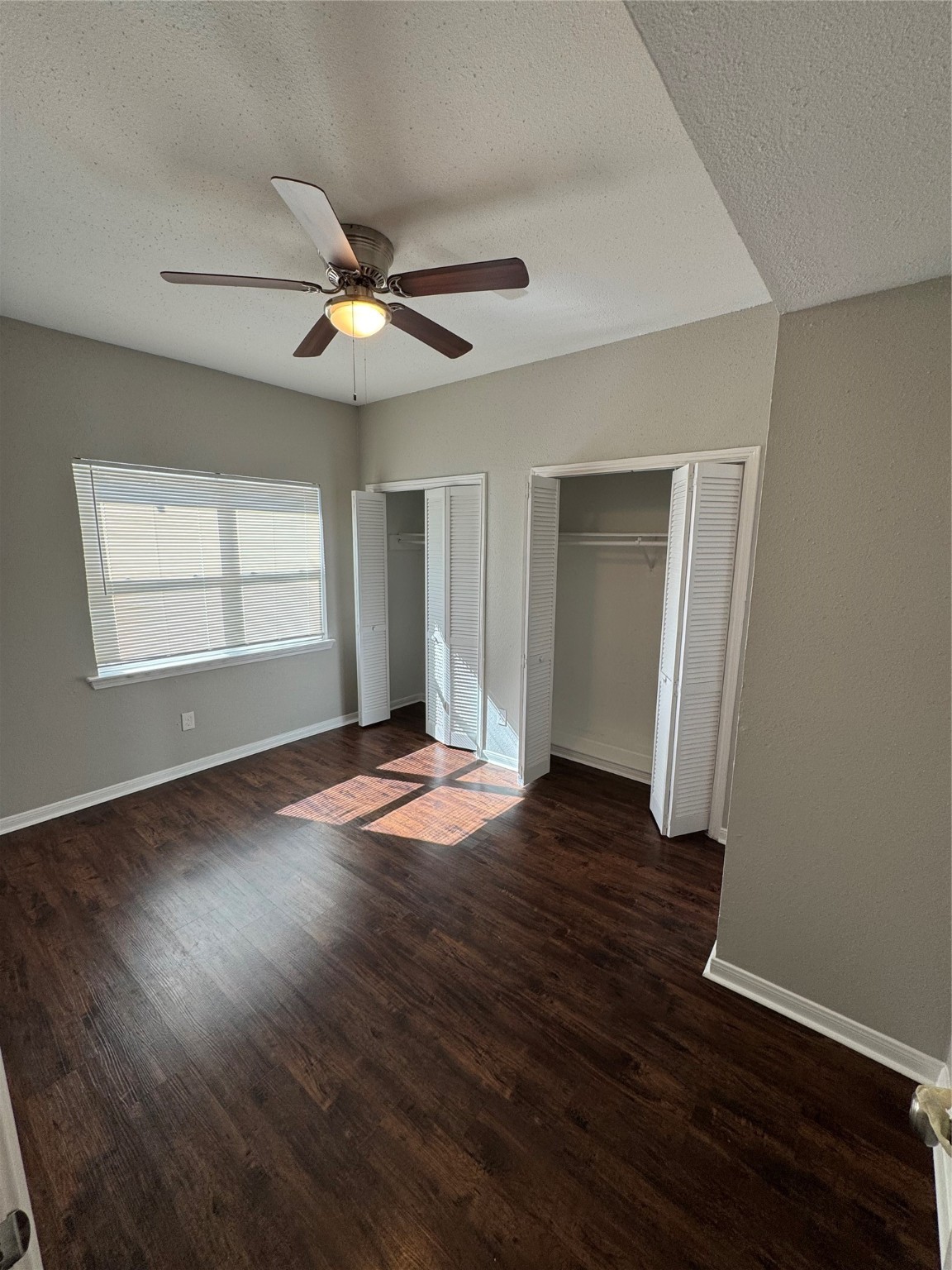 7700 Creekbend Drive, Unit 72 Houston, TX 77071 - Photo 10 of 21 a view of empty room with wooden floor and fan