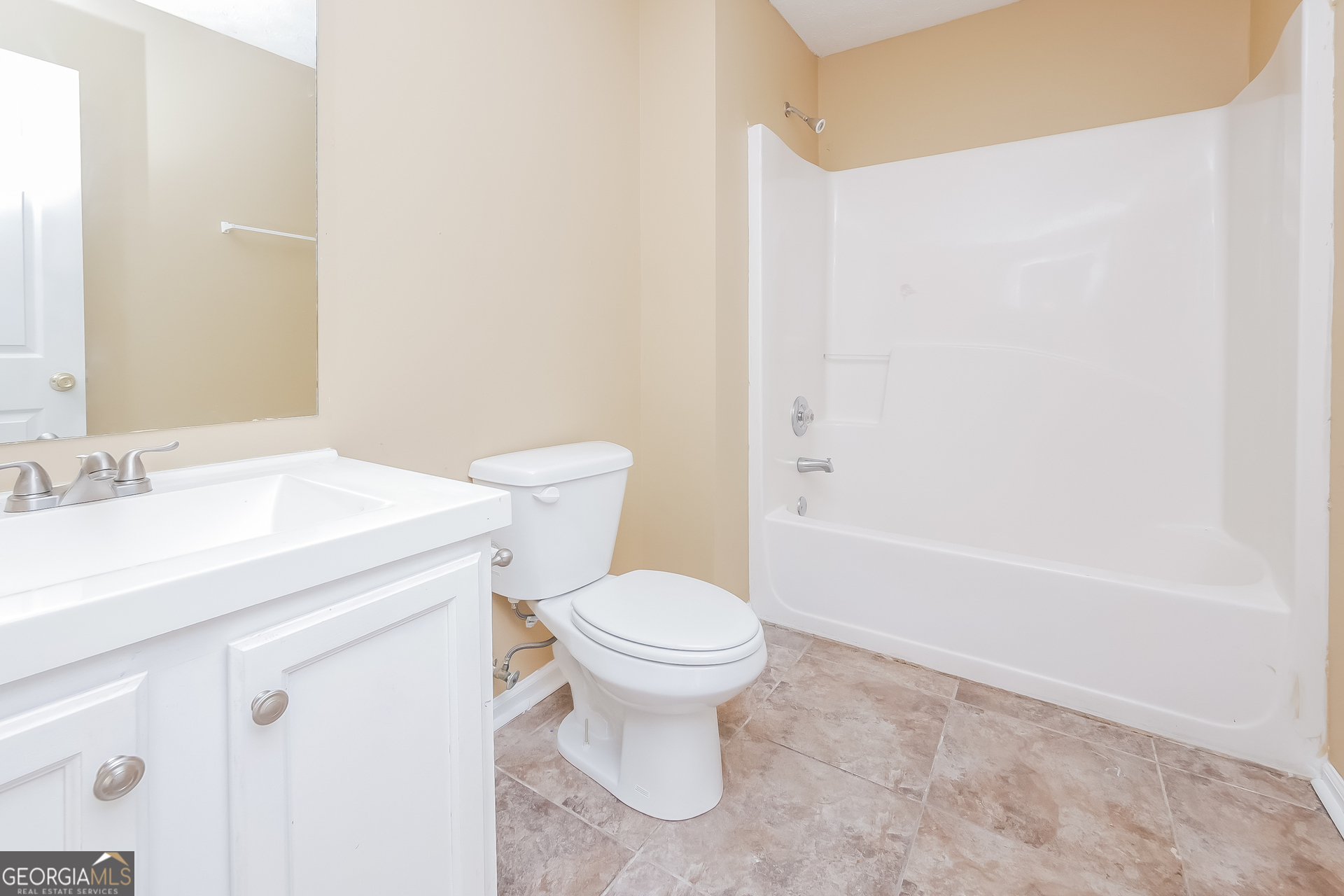 101 Bradesbury Lane Locust Grove, GA 30248 - Photo 13 of 17 a bathroom with a sink toilet and a bathtub