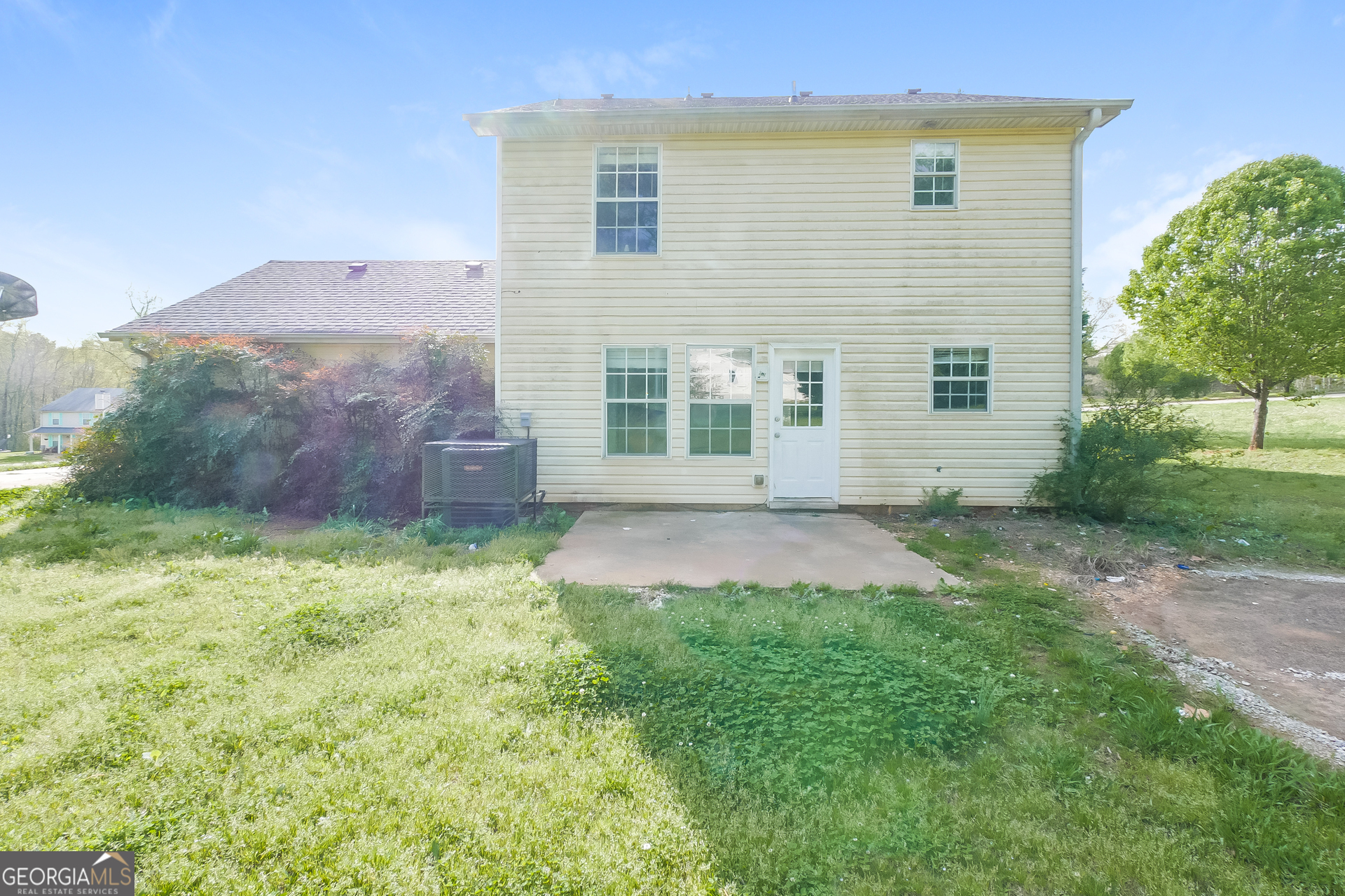 101 Bradesbury Lane Locust Grove, GA 30248 - Photo 15 of 17 a view of backyard with potted plants and wooden fence