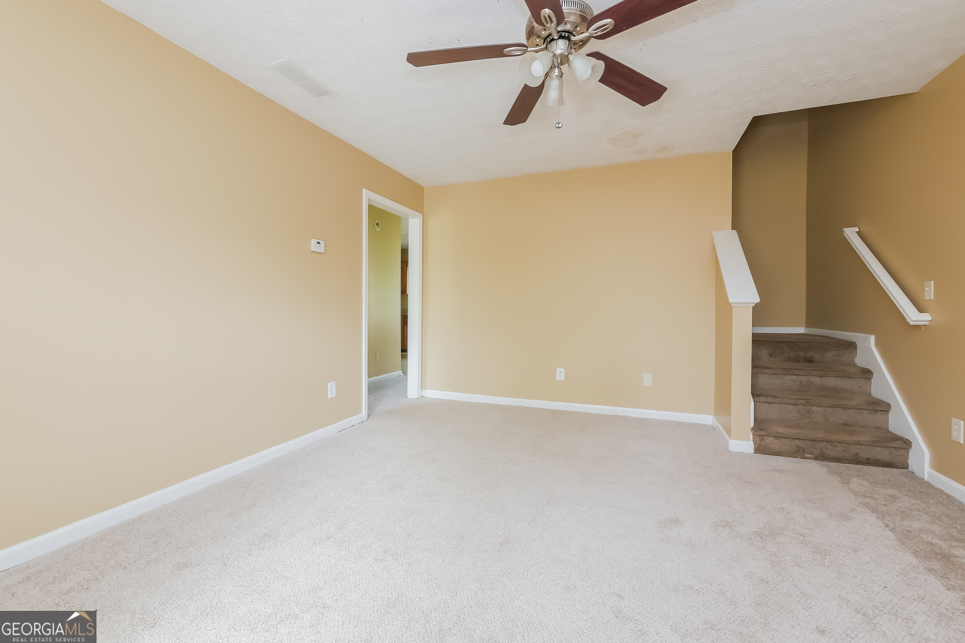 101 Bradesbury Lane Locust Grove, GA 30248 - Photo 3 of 17 a view of an empty room with wooden floor