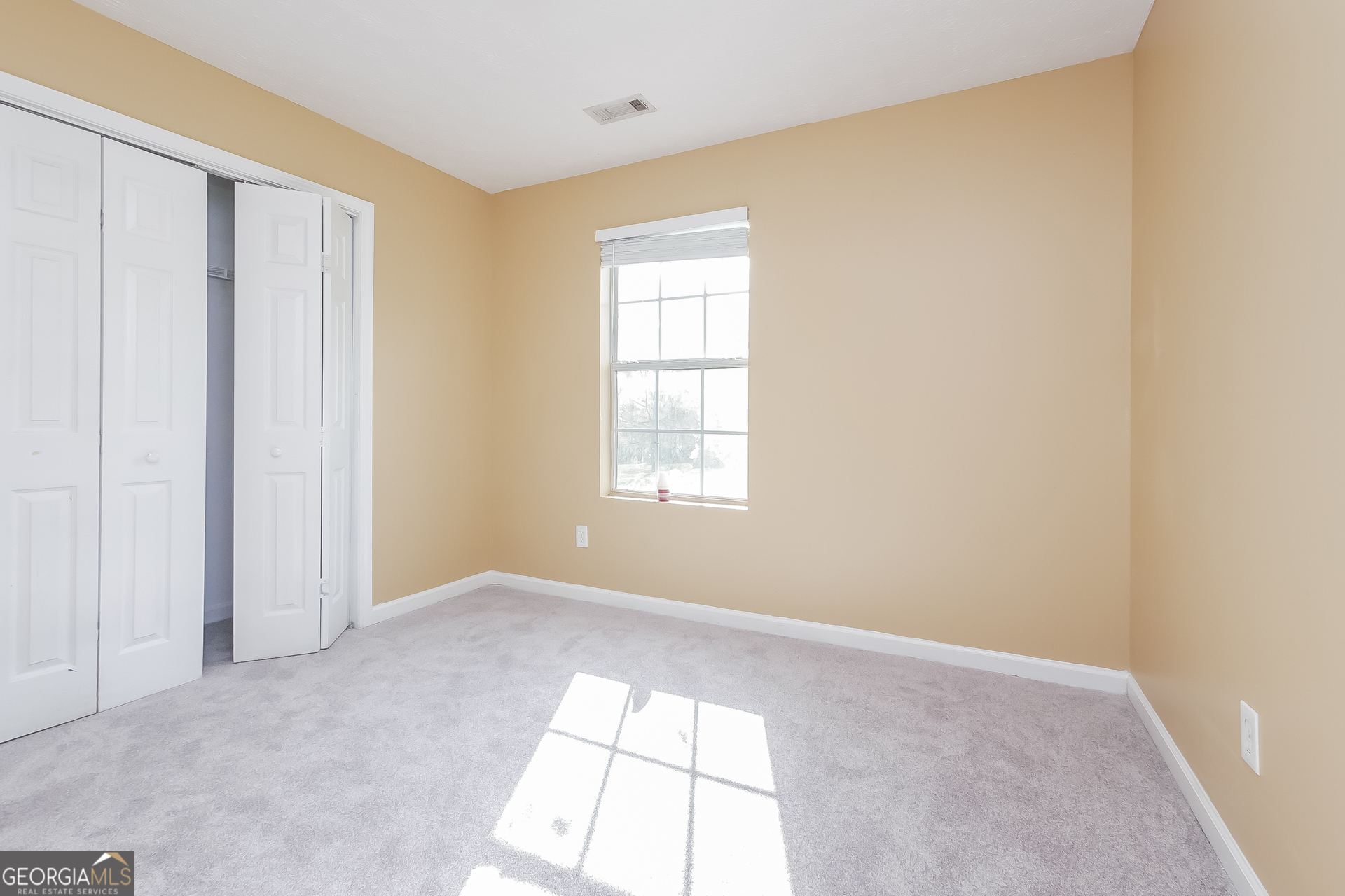 101 Bradesbury Lane Locust Grove, GA 30248 - Photo 9 of 17 a view of an empty room with a window