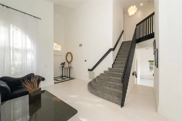 a kitchen with stainless steel appliances granite countertop a refrigerator stove and microwave