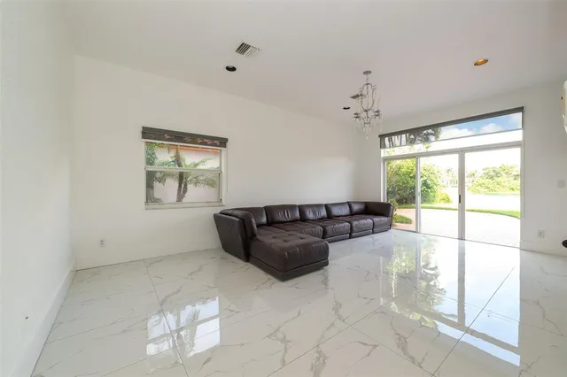 a kitchen with a stove a sink and a microwave