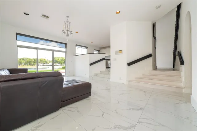 a kitchen with a refrigerator and a stove