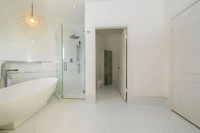 a view of a lake with a big yard and palm trees