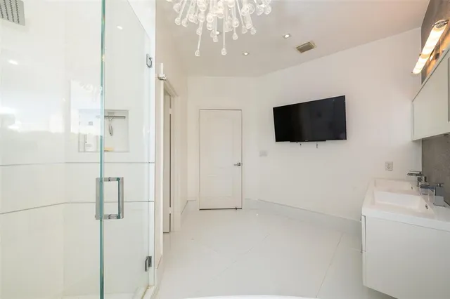 a front view of a house with a garden and yard