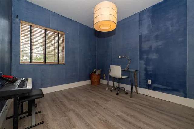an aerial view of residential houses with outdoor space and lake view